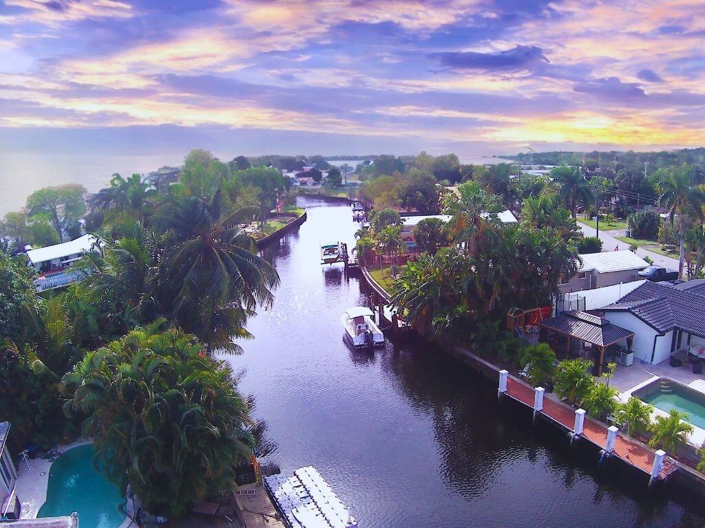 This newly renovated waterfront home, located on the border of Pompano Beach and Fort Lauderdale, FL, offers ocean access with no HOA. It features 3 bedrooms, 3 bathrooms, updated interiors, stainless steel appliances, fully storm-protected windows and doors, and modern finishes. The property includes a private dock that can accommodate a boat up to 60 feet, along with ample outdoor space for a pool, RV, or additional watercraft. Situated on a large lot in a quiet cul-de-sac, it's near top-rated schools and major restaurants, shopping, and entertainment. With significant city improvements underway, it presents a strong investment or long-term living opportunity.
