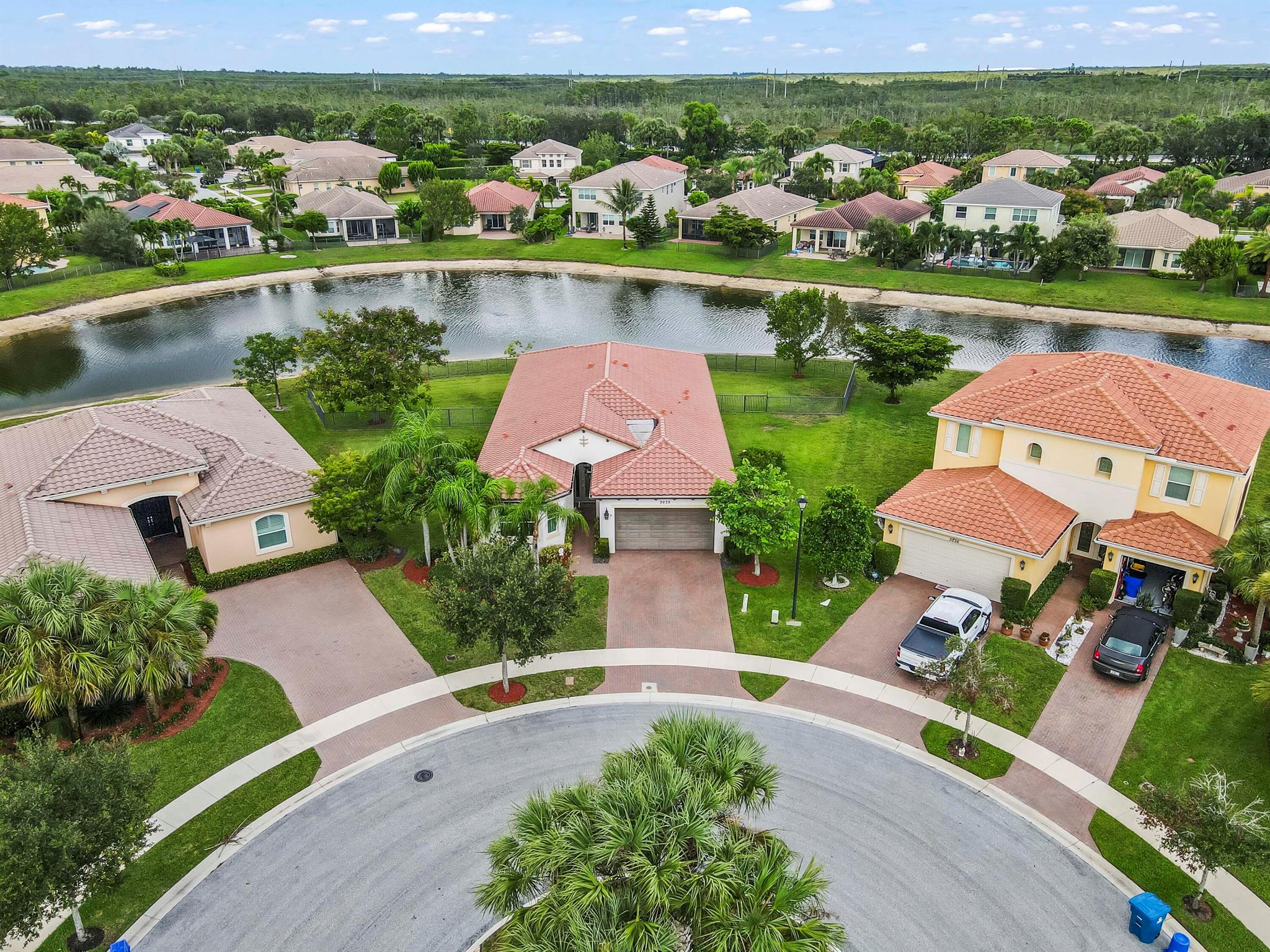 From the moment you arrive, you will be captivated by this stunning waterfront single-family home, perfectly situated on a cul-de-sac and an oversized lot with lush landscaping in the prestigious gated community of Portosol. This residence, with its 3 full bedrooms, 2.5 bathrooms and a den is designed for both elegant living including tray ceilings & custom moldings throughout and everyday comfort. A grand entrance leads to a formal dining room, perfect for hosting unforgettable gatherings, while the thoughtful split-bedroom floor plan ensures privacy for all. This home also features a dedicated office or den, providing an ideal space for remote work or a quiet retreat and can easily be converted to a 4th bedroom if needed.