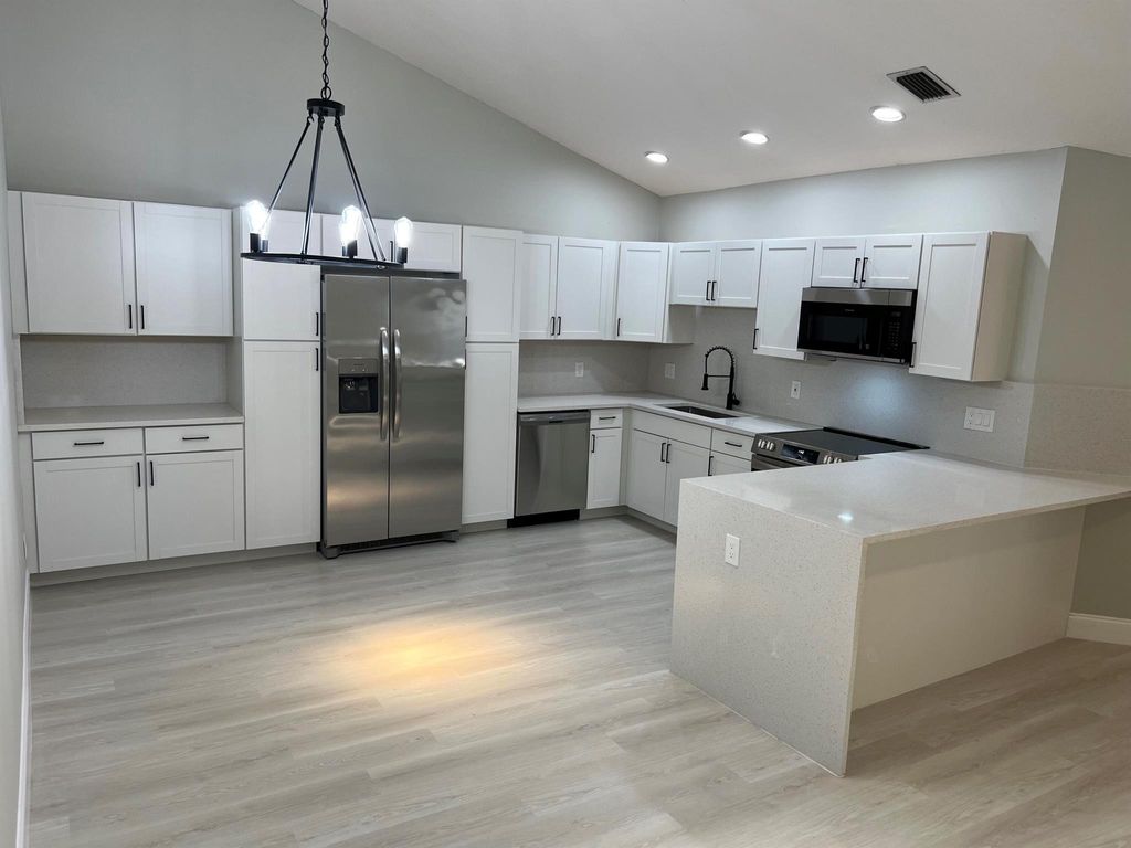 Photo of 12592 Woodmill Drive, Palm Beach Gardens, FL 33418 (MLS # R10989714)