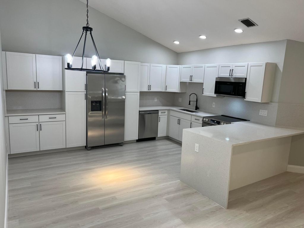 Photo of 12592 Woodmill Drive, Palm Beach Gardens, FL 33418 (MLS # R10989714)