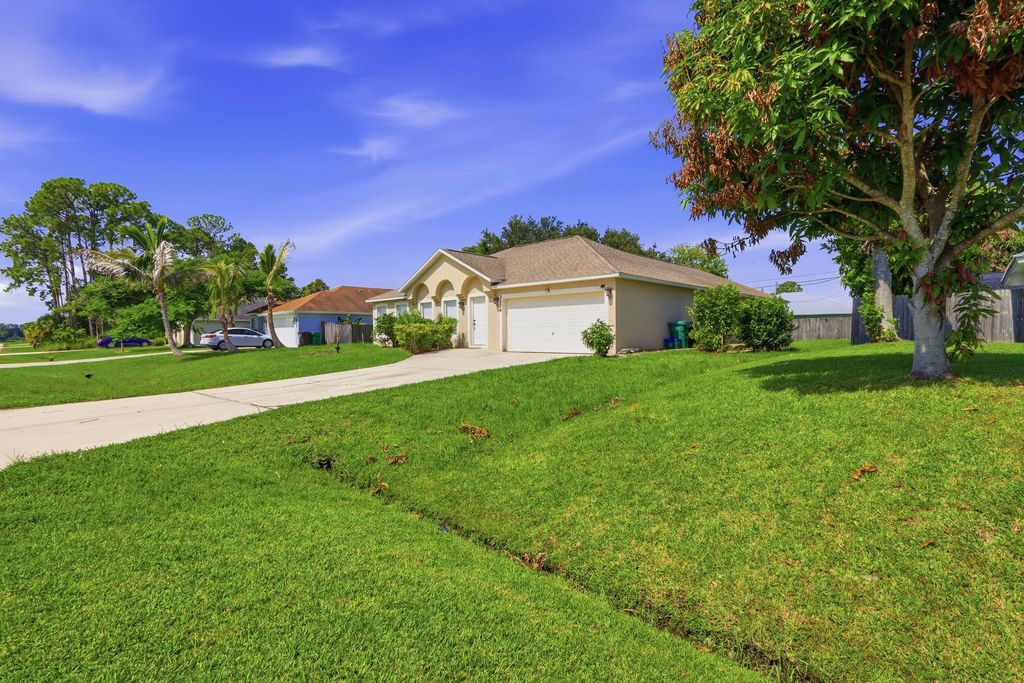 Photo of 3124 SW ARMUCHER Street, Port Saint Lucie, FL 34953 (MLS # B26057641)