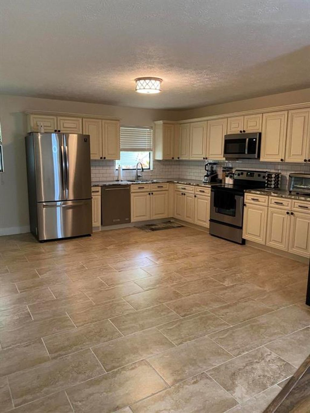Photo of 1136 SE Sandia Drive, Port Saint Lucie, FL 34983 (MLS # R10783554)
