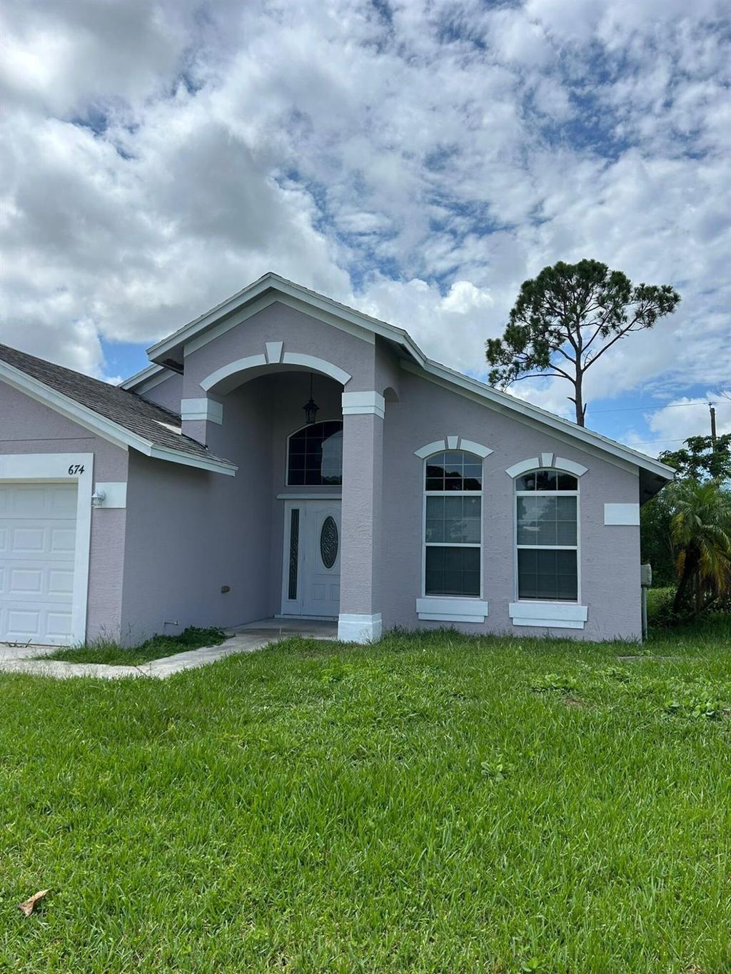 Photo of 674 SE Thornhill Drive, Port Saint Lucie, FL 34983 (MLS # R11109690)