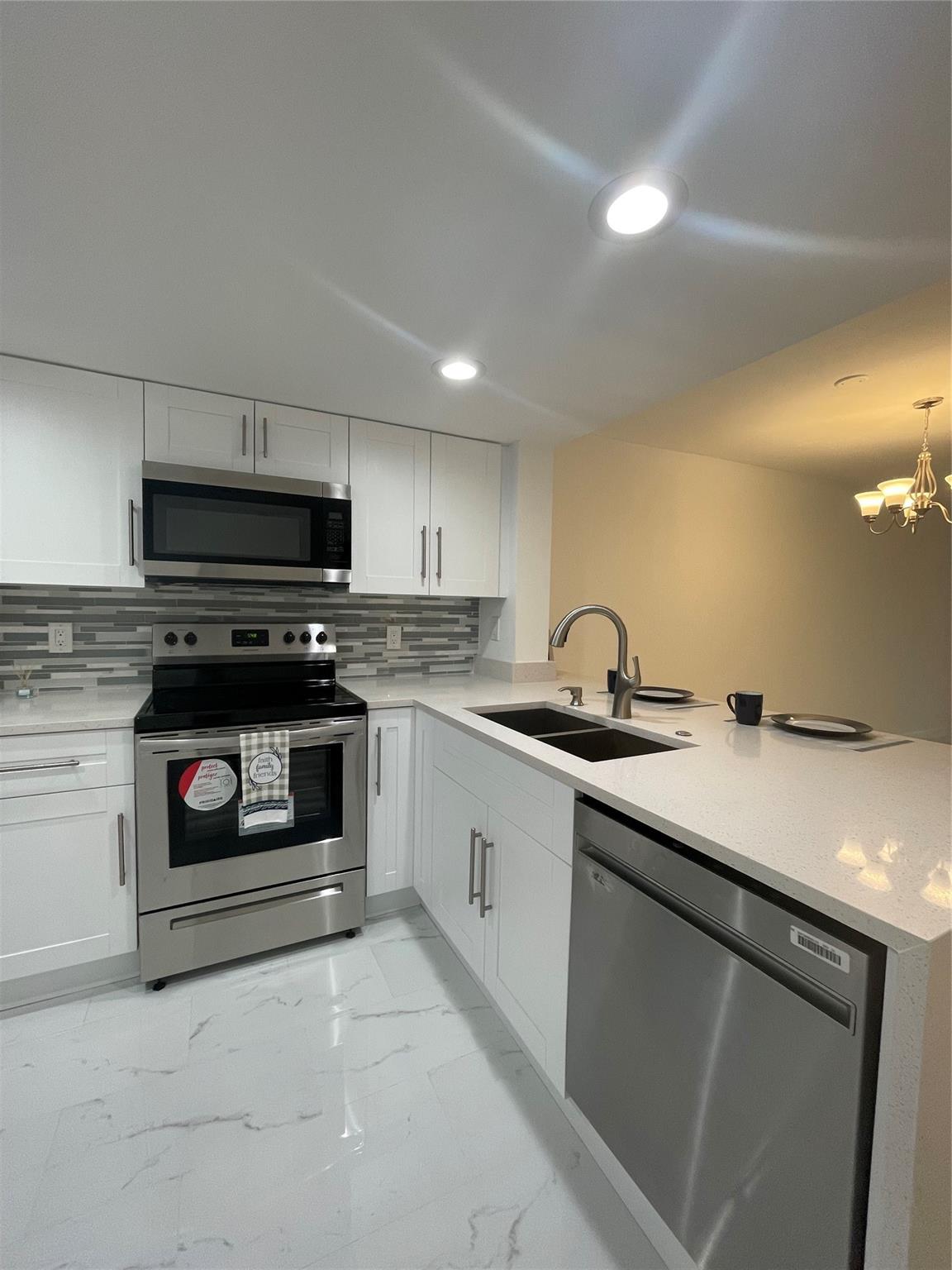 Great apartment located in the heart of Tamarac! Located extremely close to shopping malls, golf, community pool, and clubhouse. Enjoy all the amenities this property has to offer! Newly remodeled with refrigerator, microwave, stove, new dishwasher, porcelain tile flooring, amazing bathrooms, and new countertops. Washer and dryer in unit, water heater and A/C recently replaced. The screened-in patio has access to a beautiful lakefront view. This property will be rented out fast, so don't miss this opportunity! Association approval is required.