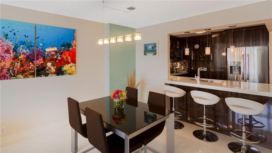 3X MINT Condition STUNNING remodeled 2br/2ba Condo. CUSTOMED DESIGNED OPEN KITCHEN, QUARTZ Counter Tops, Stainless Appliances, HiGloss White Ceramic Floors. Impact Windows & Door, 2-20lbs PETS OK; 2 short blocks from Ft Laud Bch; A-rated school districts; Mt ($692) includes CAT 5 fiber optic hi-speed Internet, HD TV Reserves. WD on the floor; Garage parking;24/7 front desk, pest control, Currently, NEW Infinity Heated Pool, Tennis, Pickle Ball, Bocce, Billiards, Ping Pong, BBQ pavilion w/ Refrig, State of the Art Fitness Center, Running/Walking Track around the building, NU Glass BALC