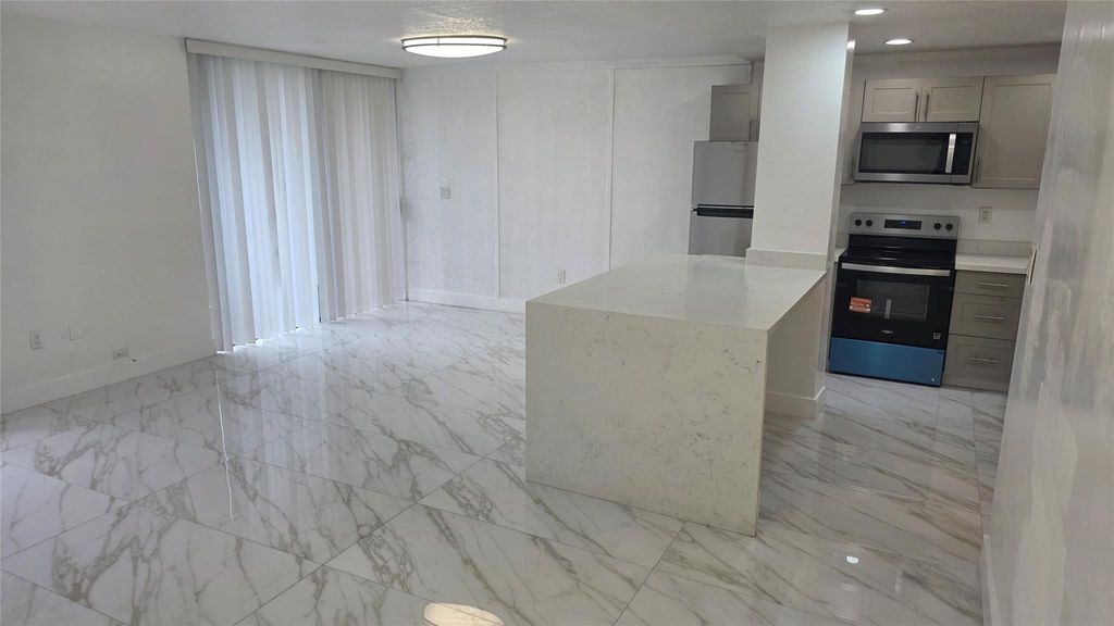 Photo of 1758 NW 55 Ave #101, Lauderhill, FL 33313 (MLS # F10550864)