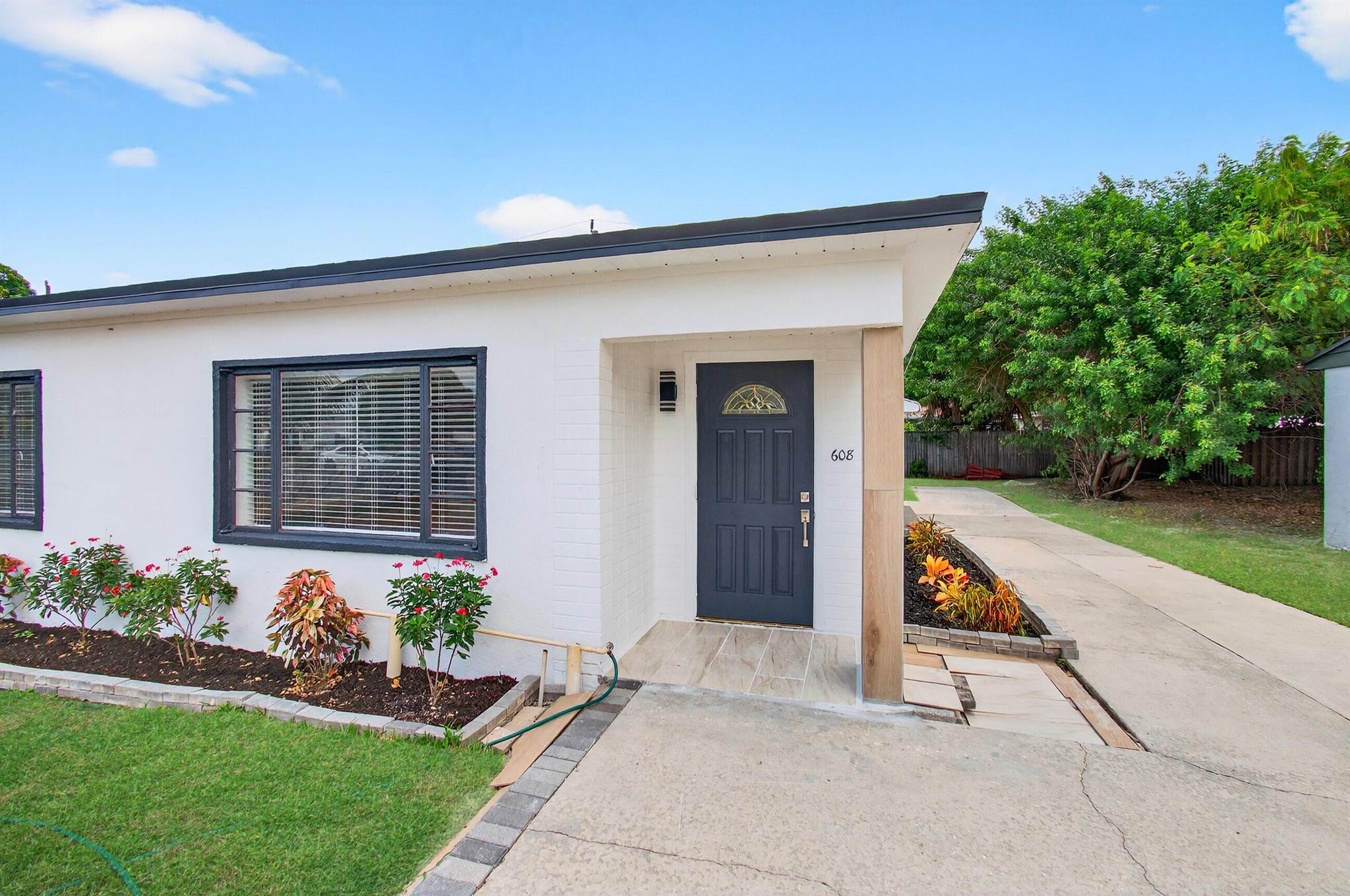 This home is completely remodeled and move-in ready! The home has a brand new roof, newer electric, plumbing, and air conditioning. The flooring is easy-care laminate throughout. The appliances are all new. The home is freshly painted. The bathrooms have been tastefully remodeled. Look at the gorgeous tile work! The home sits on a large lot. Minutes from the highway, Airport, Beaches, Mar-a-Lago, University, Palm Beach Downtown, City Place, shopping, and fine dining. The home has an extra-long driveway so you can park your RV or boat there is NO HOA. This home is perfect for first-time buyers or an Airbnb. Come quickly to see this one, it will be gone soon!