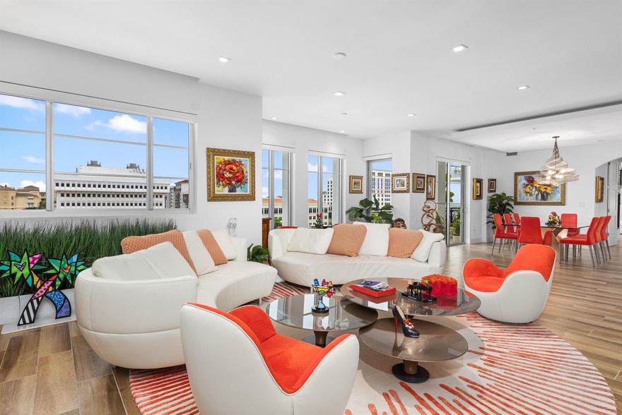 Welcome to Residence 812 at Tower 155, a distinguished offering within this premier luxury condominium in downtown Boca Raton. Encompassing 2,810 square feet, this residence is one of the most expansive in the building, featuring an open, light-filled layout and meticulously curated finishes throughout. The home conveys a sense of balance and refinement, where thoughtful design creates a harmonious environment for living and entertaining. Upon entering the residence, you are welcomed in the foyer by high ceilings and beautiful porcelain tile flooring, which flows throughout the main living spaces, setting an elegant tone from the moment you arrive. The oversized living, dining, and kitchen areas transition seamlessly, each appointed with high-end materials and sophisticated detailing.