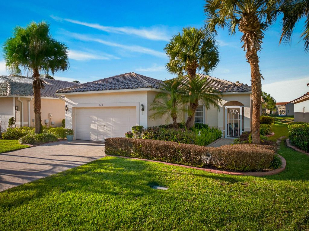 Photo of 320 NW Treeline Trace, Port Saint Lucie, FL 34986 (MLS # B26000938)