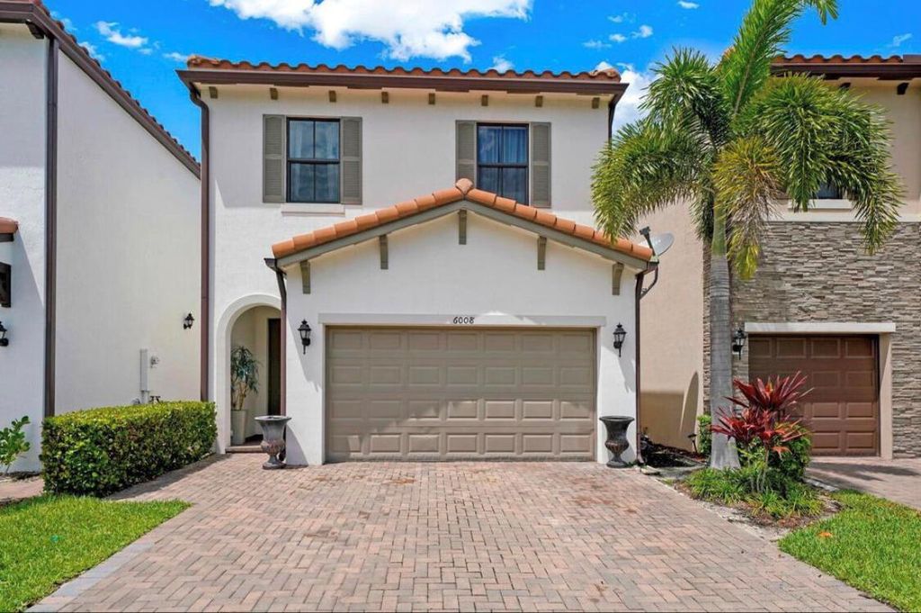 Photo of 6008 Pine Tree Way, Riviera Beach, FL 33410 (MLS # R10921173)