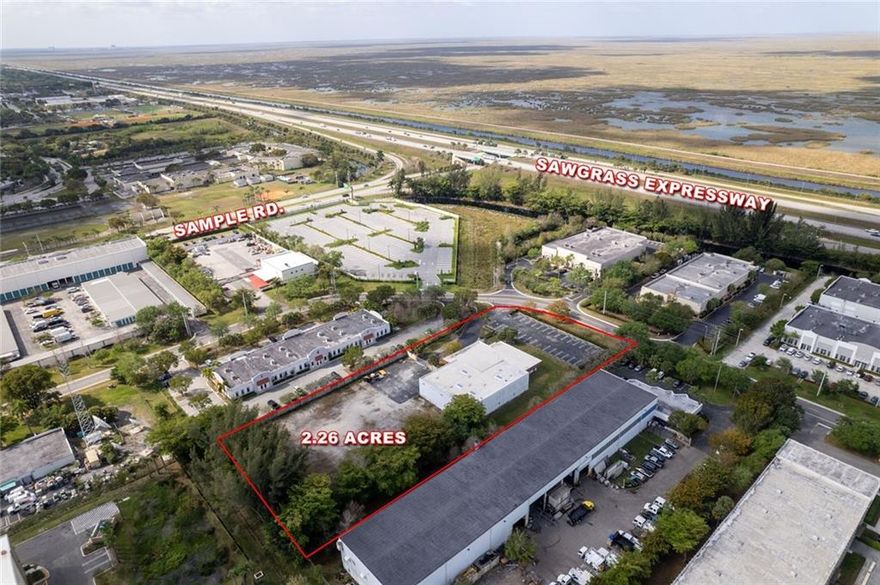 NEED OUTDOOR STORAGE ? +/- one acre walled/gated outdoor storage area. NEED ROOM TO GROW? Can build up to 15,000sf additional warehouse per architect. NEED ACCESS TO HIGHWAY? One minute from property to Sawgrass Expressway at Sample Road. Building is 55% office (6,500sf) /45% warehouse (5,500sf). Some office can be easily demoed as walls do not penetrate ceiling grid. Substantial seller financing available to qualified buyers.