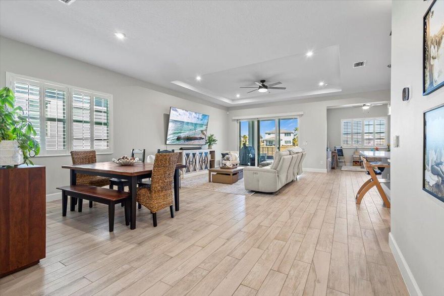 Move in ready.. Lakefront, 4bed 3 bath, built in 2024, Meridian Model..beautiful home with many already added in builder upgrades and then some; better than new! Some upgrades include custom built master closet and pantry (10/25) tile floors throughout home, plantations shutters on all windows, fenced in yard, epoxy garage floor, brand new whole house water treatment system & reverse osmosis filtration (1/26), retractable blinds on back door sliders, and upgraded LG washer and dryer..Turnkey modern home with spacious designer kitchen, and open layout located in Seville at Tradition offering resort-style amenities including a pool and pickelball..a playground for the kiddos.. new clubhouse and gym due 5/26..HOA fees include cable, internet, lawn, and regular neighborhood patrol.. a gem!!!