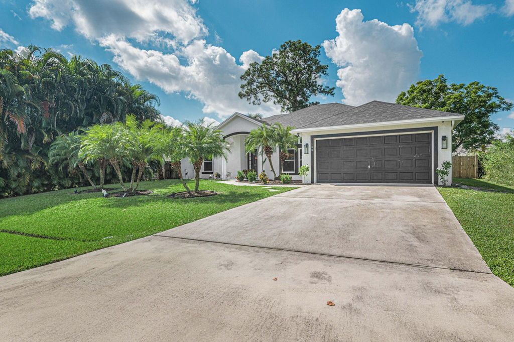 Photo of 1158 SW London Ln, Port Saint Lucie, FL 34953 (MLS # R10920803)