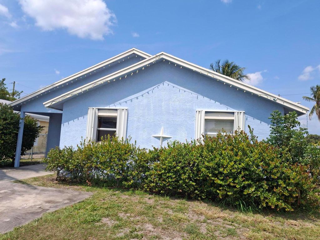 Photo of 3391 Avenue, Riviera Beach, FL 33404 (MLS # B26023675)