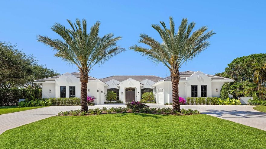 Brand-new custom estate in the exclusive enclave of Place Au Soleil, offering an exceptional blend of architectural presence, modern luxury, and effortless livability. Set on an oversized half-acre corner lot just minutes from Atlantic Avenue, this British West Indies-inspired single-story residence showcases soaring wood-paneled ceilings, bespoke custom cabinetry throughout, and beautifully curated designer finishes that create a warm yet sophisticated atmosphere. Expansive interiors seamlessly transition to resort-style outdoor living and entertaining spaces, delivering the ultimate South Florida lifestyle. A true custom property featuring smart home technology, full-house generator, and every detail thoughtfully designed for elevated everyday living. KEY FEATURES & HIGHLIGHTS  Property & Layout  • 5 Bedrooms | 5 Bathrooms • 4,872 Sq Ft Under Air | 6,675 Total Sq Ft  • Rare single-level living with seamless flow  • Oversized 21,851 Sq Ft lot (0.50+ acres)  • Full 3-car garage + expansive motor court (fits ~10 vehicles)  • Immediate occupancy available    Interior Design & Living  • Soaring ceilings with dramatic great room and floor-to-ceiling glass  • Coffered ceiling detail and statement fireplace  • Professionally curated interiors with timeless coastal palette  • Open-concept layout designed for entertaining and everyday ease  • Dedicated lounge space off the kitchen    Chef's Kitchen  • Sub-Zero, Wolf, and Fisher & Paykel appliance package  • Oversized 5' x 16' island • Hidden, oversized butler's pantry  • Gas conversion infrastructure already in place    Primary Suite Retreat  • Private sitting area  • Spa-level bathroom with soaking tub and multi-head shower  • In-suite dry sauna  • Dual custom walk-in closets (ready for buyer selection)  • Integrated bidet system    Outdoor Living  • Resort-style infinity-edge pool and spa  • Dual sun shelves with varying depths  • Expansive covered lanai with full summer kitchen and bar  • Outdoor fireplace and entertainment lounge  • Architecturally designed loggia prepped for retractable screens  • Lush, private half-acre setting    Smart Home & Systems  • Centralized smart home control (climate, lighting, audio)  • Pre-wired for full-house audio, security, and future expansion  • Pre-wired windows for motorized shades or smart glass  • Whole-house Generac generator  • Three-zone HVAC system  • Tankless water heaters  • Whole-home water filtration    Community & Location  • Private Intracoastal community with 24/7 police presence  • Golf cart-friendly neighborhood  • Very low HOA ($22/month)  • Minutes to Gulf Stream Golf Club and Atlantic Avenue     All images and visual materials associated with this property, including AI generated images, virtually staged photos, edited images, artist conceptual renderings, maps, site plans, floor plans, and other graphics, are provided solely for illustrative purposes. These representations may not accurately reflect current conditions and are subject to change without notice. No representations or warranties are made regarding the accuracy or completeness of these visual materials. Buyers should not rely solely on these materials and are responsible for independently verifying all property details.