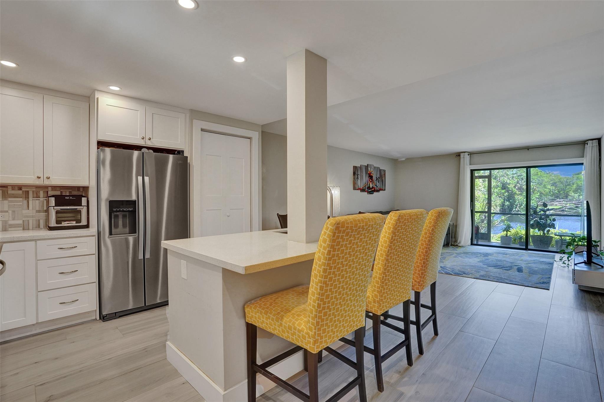 Welcome to this well-appointed 2/2 condo in the desirable Boca Terrace community. This exquisitely renovated unit features an open floor plan with lovely lake views, fully remodeled kitchen with modern appliances, and updated bathrooms. Enjoy morning coffee on the screened patio overlooking tranquil water and fountain views. Excellent location across from Sugar Sand Park with A-rated schools, restaurants and shopping. Quality updates include full-sized washer/dryer, tile flooring, and modern finishes throughout. Community amenities feature clubhouse, two pools and tennis courts. Perfectly located between Military Trail and I-95 for easy access to beaches, Town Center Mall, and everything Boca Raton offers. Exceptional value in a well-maintained community with fantastic location benefits.