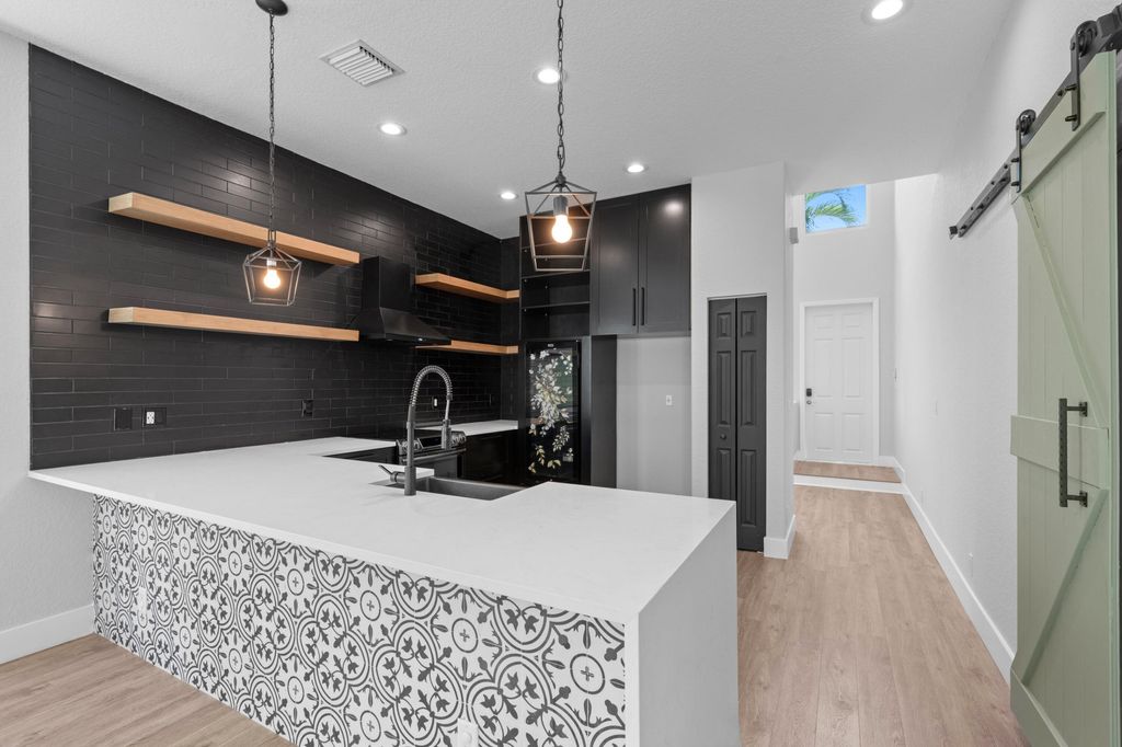 Photo of 4351 N Magnolia Circle, Delray Beach, FL 33445 (MLS # B26006854)