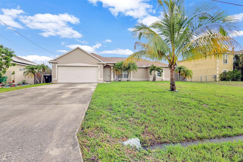 Photo of 441 SW Feldman Avenue, Port Saint Lucie, FL 34953 (MLS # R11002143)