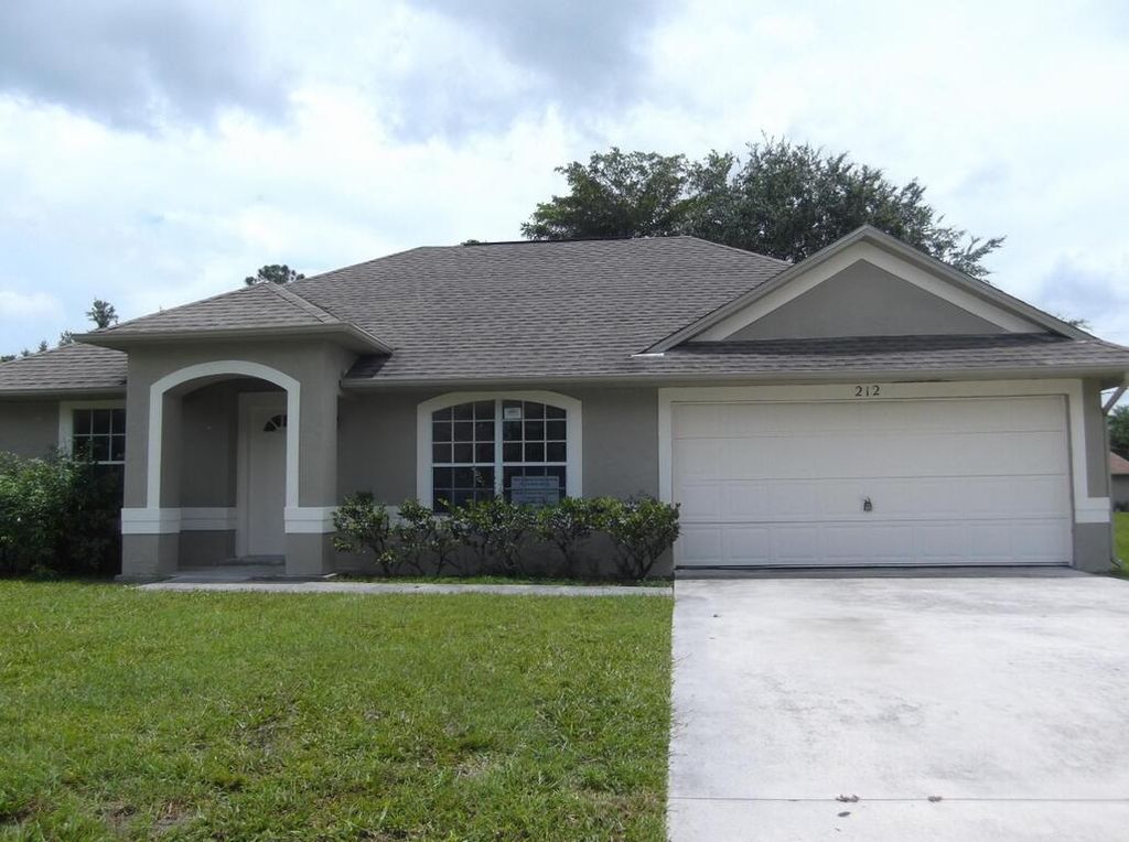 Photo of 212 SW Ewing Avenue, Port Saint Lucie, FL 34983 (MLS # B26045338)