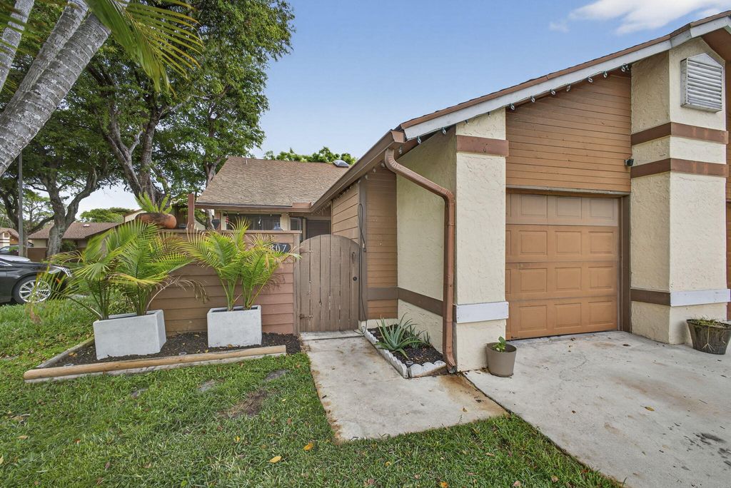 Photo of 3807 Collinwood Lane, West Palm Beach, FL 33406 (MLS # B26005143)