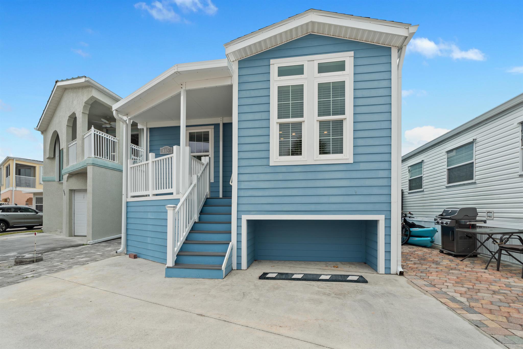 Welcome to Paradise! Freshly Painted !! Located on Nettles Island Resort, a guard-gated river community across the street from the Atlantic Ocean. This 2017 Jacobsen Modular Home features impact-resistant windows and doors along with a Hardie board exterior. A connected porch enhances outdoor living, with clear sightlines to stunning views. Additionally, under-house storage offers ample space for belongings. Turnkey and ready to move your furniture in. Nettles Island offers so many fun activities, including two heated swimming pools--one on the ocean with beach access--tennis, pickleball, horseshoes, line dancing at the beach, a large clubhouse, fitness room, cafe, games for the entire family, library, and over 40 different clubs.