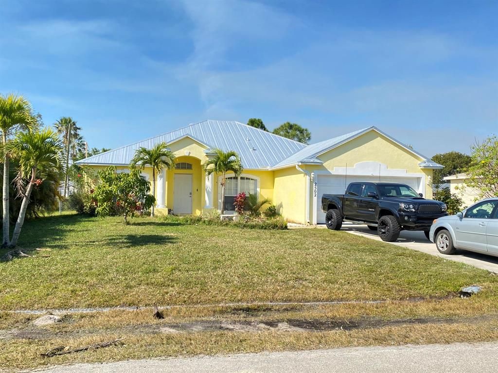 Photo of 2502 SE Burton Street St, Port St Lucie, FL 34952 (MLS # R10688297)