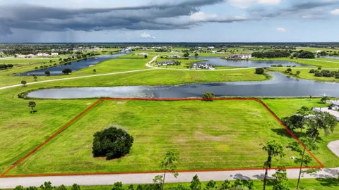 Photo of 6027 SW HIDDEN LAKE Lane, Palm City, FL 34990 (MLS # B26079525)