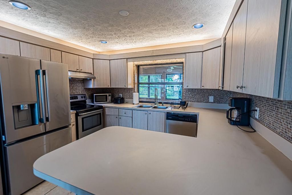 Photo of 450 SW Eyerly Avenue, Port Saint Lucie, FL 34983 (MLS # R11128188)