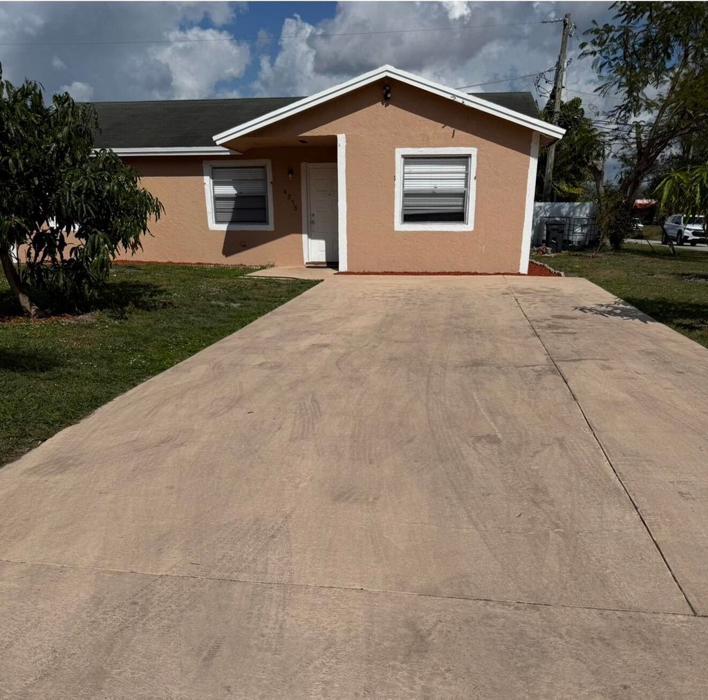 Photo of 4575 Curtis Avenue, Lake Worth, FL 33463 (MLS # B26030480)