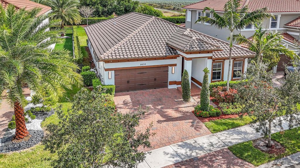 Photo of 8630 Miralago Way, Parkland, FL 33076 (MLS # F10535075)