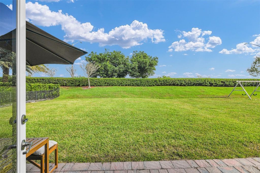 Photo of 8630 Miralago Way, Parkland, FL 33076 (MLS # F10535075)