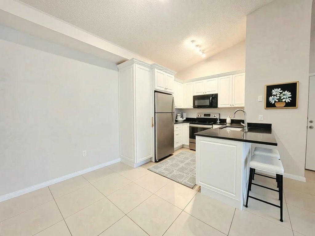 Photo of 911 LYONS Road #2204, Coconut Creek, FL 33063 (MLS # B26078215)