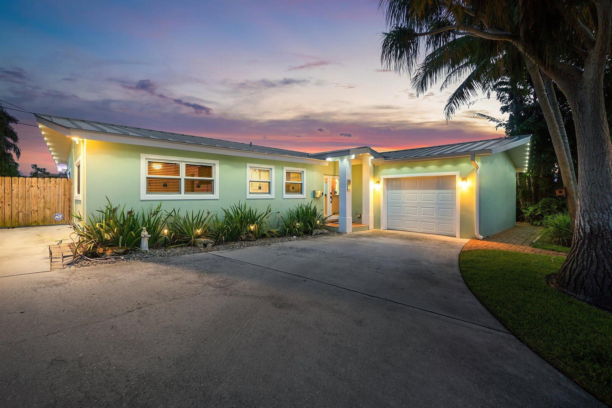 This beautifully updated 3-bed, 2-bath home offers 2,085 sq. ft. of total space in the heart of North Palm Beach. Features include a 2021 metal roof, whole-house impact windows and doors, a gas kitchen, and a spacious dining area. The stunning Florida room with vaulted ceilings is perfect for entertaining. The home is freshly painted and includes a tankless water heater. Outside, enjoy a fenced backyard, a single-car garage with washer/dryer, and boat parking with an electric hookup. Best of all, there's no HOA. Located just around the corner from the North Palm Beach Country Club, home to a Jack Nicklaus Signature public golf course. A true gem in North Palm Beach!