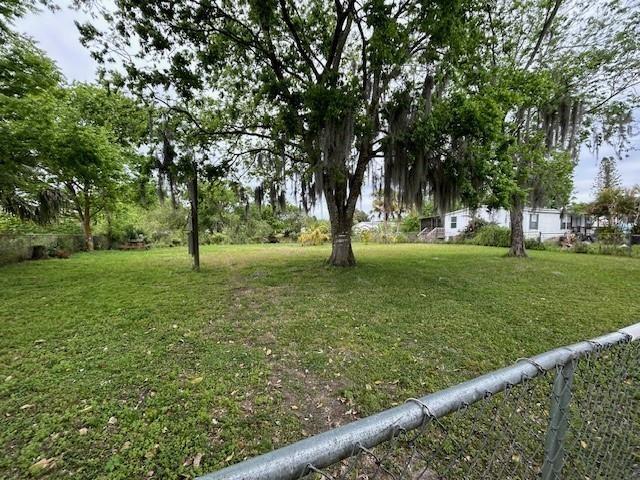 Vacant lot with a great location!! Zoned for a single wide or larger mobile home or house has water /  on canal has large shade trees and fruit trees such as Guava/ lychee nut /variety of 7 citrus trees Bananas/5 mango/6 coconut trees property is chain link fence on front and both sides about 5 miles from town neighbors on one side.