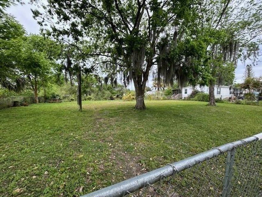 Vacant lot with a great location!! Zoned for a single wide or larger mobile home or house has water /  on canal has large shade trees and fruit trees such as Guava/ lychee nut /variety of 7 citrus trees Bananas/5 mango/6 coconut trees property is chain link fence on front and both sides about 5 miles from town neighbors on one side.