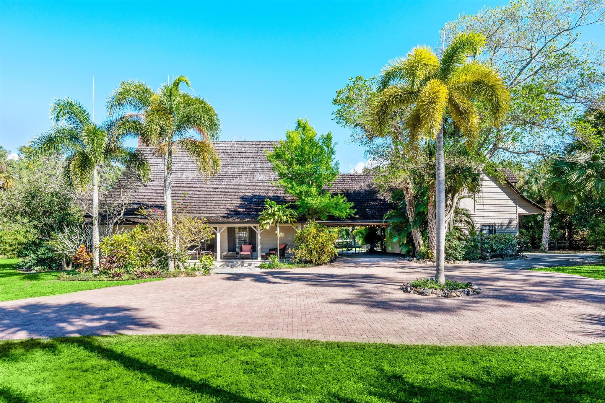 Truly a rare find in Wellington! Take advantage of two separately deeded parcels for a combined 6.19 acres in the heart of Wellington! One lot which has the home and stable, sits on 3.74 acres! The lot with the arena is sitting on 2.45 acres! If location is important to you then you simply can't beat the proximity to the equestrian events as well as all other major amenities! While location is perfect, so is the functionality of your business! This is one of the highest lots in all of Little Ranches! This home takes you back in time as this was the original Stribling home! Now it's your turn to create your own memories and history! Large home with plenty of space for the whole family! Bring your horses and enjoy the 15 stalls and plenty of green pasture! You can feel lucky you're here!