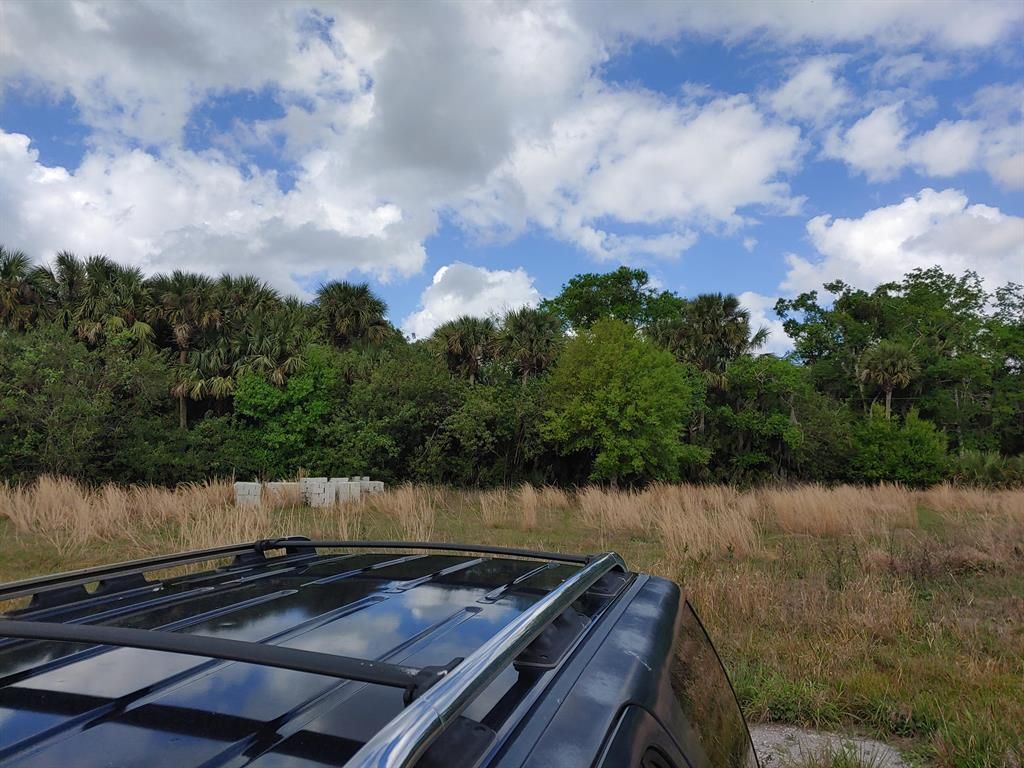 Photo of Tbd Germany Canal Road, Fort Pierce, FL 34950 (MLS # R10698198)