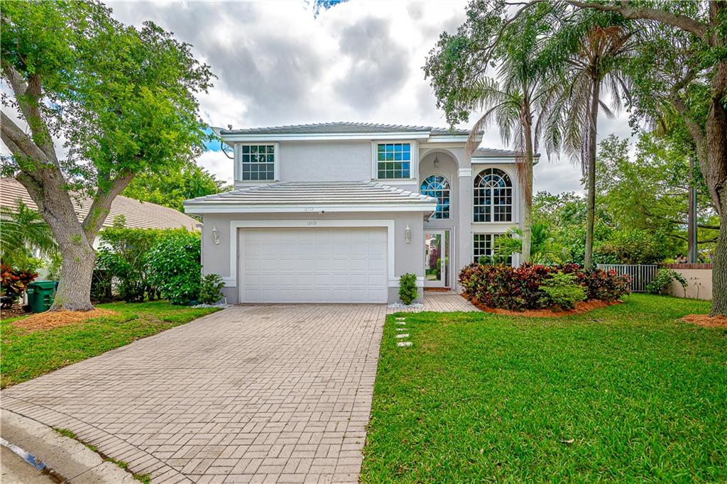 HOME LOCATED IN PRESTIGIOUS, GUARD GATED, GOLF COMMUNITY OF EAGLE TRACE! NEW ROOF 2023! HOME WARRANTY FOR 1 YEAR ON ROOF TRANSFER TO NEW BUYERS. CORNER LOT/ CUL-DE- SAC. HEATED POOL W/SCREEN ENCLOSURE & POOL FENCE. ACCORDION SHUTTERS. FRESHLY PAINTED EXTERIOR. NEWLY REMODELED KITCHEN W/QUARTZ COUNTER TOPS W/ISLAND & NEW KITCHEN SINK. STAINLESS STEEL APPLIANCES DOUBLE OVEN. NEW LIGHTING THROUGH-OUT, NEW FLOORING ON STAIRS & 2 FLOOR. NEWLY COMPLETED SECOND FL BATHROOM. UPDATED A/C'S UNITS. TILE FLOORING 1ST FIRST FLOOR. MASTER HAS WALK-IN CLOSET W/TRAY CEILING & MASTER BATH HAS ROMAN TUB W/SEPARATE SHOWER. LAUNDRY ROOM. REMOVABLE BOOKCASE LEADS TO UNDER STAIRS STORAGE! FIFTH BEDROOM COULD BE USED AS AN OFFICE. WALK TO CLUBHOUSE, COMMUNITY POOL, TENNIS/PICKLEBALL COURTS!