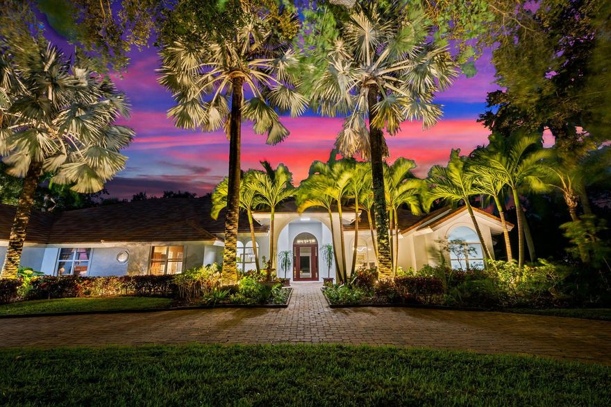 Welcome to this breathtaking 5-bedroom, 3.5-bath estate in the exclusive, guard-gated community of Fieldbrook Estates in the heart of Boca Raton. Situated on a full 1-acre lot of lush, tropical landscaping, this home offers the ultimate blend of privacy, elegance, and South Florida living. Flooded with natural light, the bright, modern interior showcases gorgeous updates and luxurious finishes at every turn. The expansive primary suite is a true retreat -- a huge bedroom paired with a stunning, spa-like bath designed for ultimate relaxation. A sleek wet bar and a gorgeous gourmet kitchen with high-end appliances elevate the home's everyday comfort and entertainment appeal. Impact windows and doors throughout provide peace of mind and efficiency. The backyard is a resort-inspired paradise.