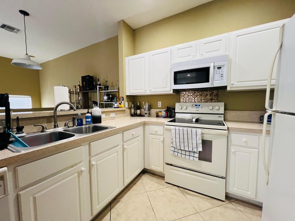 Photo of 3025 Grandiflora Drive, Greenacres, FL 33467 (MLS # B26006147)