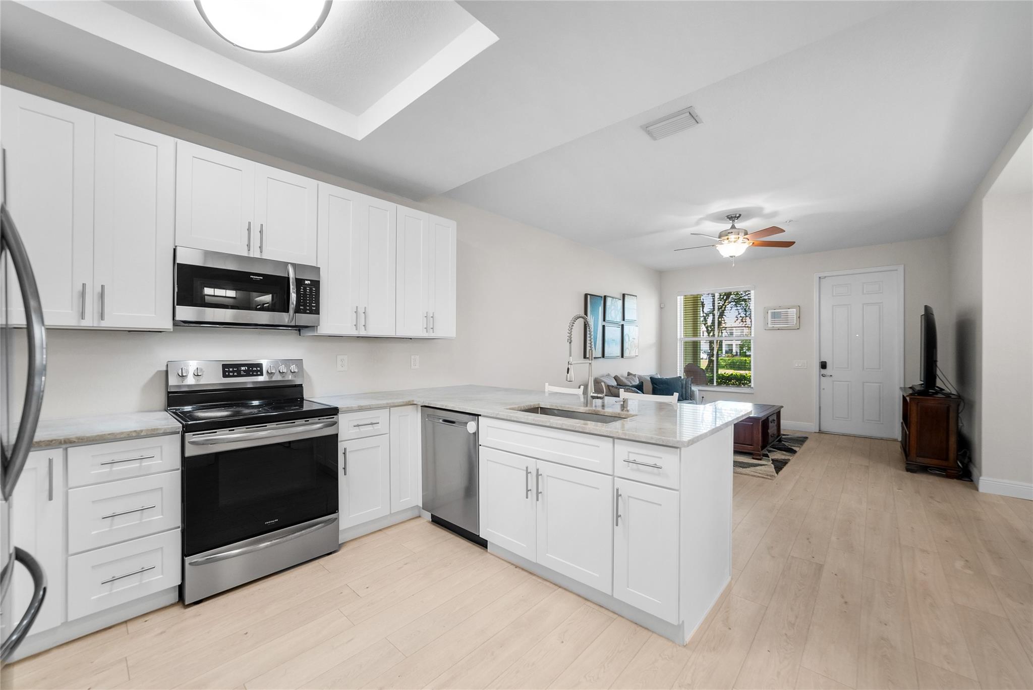 Stunning 3 Bed 2 1/2 Bath Townhome w/ 2 Car Garage in Desirable Paloma Lakes! Features Include Completely Renovated Kitchen with/ Gorgeous Quartz Countertops, New White Cabinetry, Stainless Steel Appliance, Luxury Vinyl Wood Floors Throughout First Level, AC-2021, Accordion Shutters, All Bedrooms are Upstairs, Primary Bedrooms has 2 Walk in Closets and a Balcony Overlooking the Lake, Laminate Wood on 2nd Floor, No Carpet, Washer and Dryer is Upstairs, Community is Gated and Has a Pool, Association Includes All Roof Repairs and Replacement, All Exterior Repairs and Exterior Insurance Also Included, Must have 700 Credit Score Per Association and Can Not Rent for 1st Year. Walking Distance to Promenade w/ Dining, Shopping & Entertainment. Close to Sawgrass Expwy, Don't Miss This One!