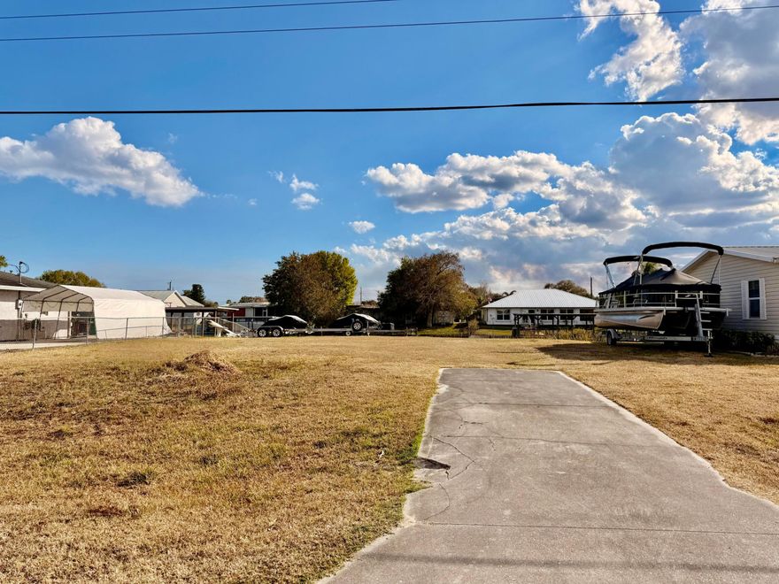 TAYLOR CREEK ISLES~ This lovely lot is ready for its NEW home. As it had a previous home, the SEAWALL is intact.  Utilities are available, water and sewer. 
Current driveway is in good shape.  Located  on  34th, it is the perfect location, near Publix, Walmart and Home Depot. WHAT A RARE FIND!!