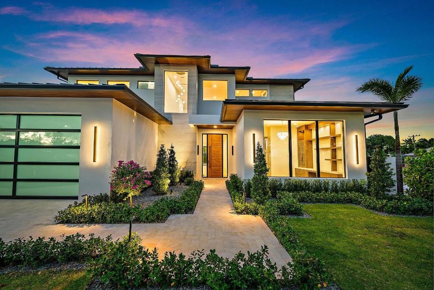 Welcome to 247 Seville Road, a stunning 2025 modern-coastal residence with subtle Balinese influence, meticulously crafted by Spyglass Development. Set on an oversized 11,285 SF lot in West Palm Beach's highly coveted SoSo neighborhood, this newly built estate blends design, craftsmanship, & lifestyle into a refined coastal retreat. Offering 6,378 total square feet with 5,112 SF of living space, the main residence features 4 bedrooms, an office, 4.5 baths, a double garage, & an elevator across 4,785 SF. A 327 SF cabana/flex suite with full bath, outdoor shower, & Sub-Zero under-counter drawers serves as a 5th bedroom, guest suite, second office, or fitness studio. A dramatic porcelain-travertine façade & 10-ft entry door introduce a beautifully executed interior with 48x48 Italian porcelain floors, a floating white-oak & glass staircase, rift-cut white oak cabinetry, fluted wall panels, & 9-ft interior doors. The chef's kitchen showcases Nika Quartzite counters, a 12x5 island, Sub-Zero refrigeration towers, a 48" Wolf 8-burner range, walk-in pantry, & a custom rift-cut oak bar with Sub-Zero wine tower. 

While the photos convey the architecture and design, the home's true atmosphere is even more compelling in person-- warm natural light, layered textures, and beautifully balanced finishes create a richer, more inviting experience than images alone can capture. 

The first-floor primary suite includes oak flooring, dual custom closets, LED lighting, & a spa-inspired bath with dual 16-ft showers, soaking tub, & dual water closets. 

A refined office with oak flooring & American Black Walnut cabinetry completes the main level. 

Upstairs offers a loft with built-ins & Sub-Zero beverage center, a secondary laundry room, oak flooring, & three en-suite bedrooms, including a VIP suite, all with imported Spanish porcelain baths. 

12-foot wide bypass stackable doors open to a resort-style outdoor living retreat with a travertine fireplace wall, summer kitchen w/ grill, sink, refrigerator, cypress cabinetry, remote-controlled screens, designer lighting, & an aluminum tongue-and-groove ceiling in a wood-look finish. 

The 37x16 saltwater pool, sun shelf, & 9x9 spa create a private oasis surrounded by tropical landscaping. 

Additional features include engineered site drainage, a generator, concrete subfloors for sound/structural stability, EV pre-wire, & an air-conditioned double garage. 

Located on a quiet, tree-lined street east of Olive Avenue in SoSo, this property is moments from the Intracoastal Waterway, Summa beach, Flagler Drive bike path, world-class marinas, golf, dining, & the amenities of Palm Beach island. Downtown West Palm Beach, PBI airport, & Worth Avenue are all within easy reach, making 247 Seville Road an exceptional opportunity to own a stunning modern-coastal home in one of the area's most desirable neighborhoods.

Note: FPL is currently working on undergrounding electrical power lines in the neighborhood.

All measurements and information are deemed reliable but not guaranteed. Buyer to independently verify.