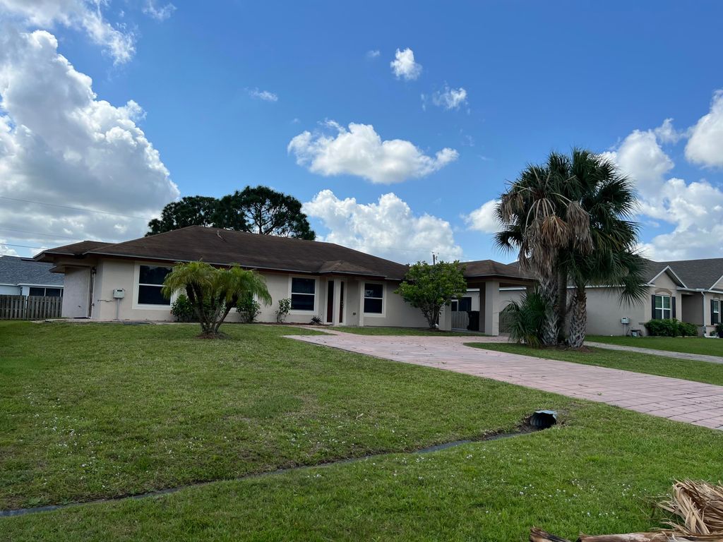 Photo of 1050 SW John Maccormack Terrace Ter, Port St Lucie, FL 34953 (MLS # R10790559)