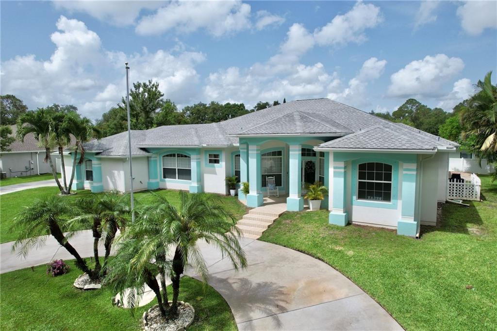 Splish Splash! Are you ready to cool down in this Captivating 4/2/3 Pool Party Paradise. 1/2 Acres of Meticulously manicured Park Like setting in a quiet neighbor complete with Peacocks! Elegant Entry with Circular Drive enhances the Breezy Beachy Vibes that remind you to RELAX. Once inside this Custom Stunner does not disappointment. Gorgeous Tile and Wood flooring through out, Crown Molding, Split Floor Plan, a Chef's Kiss Kitchen and a massive 3 car garage. Primary ensuite which covers the north end of home is your sanctuary. Watch the Sunset and enjoy Mother Natures Paradise.