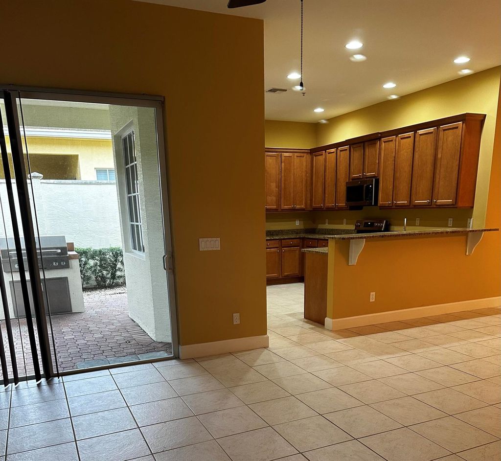 Photo of 10081 SW Dolce Road, Port Saint Lucie, FL 34986 (MLS # R10940825)