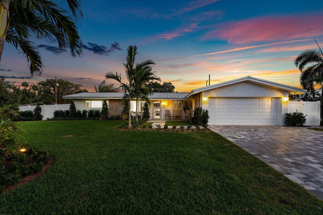 Completely gutted and rebuilt, this stunning 3BD/2BA home in the desirable Chapel Hill neighborhood is like new construction! Located just minutes from downtown Delray Beach and less than 2 miles to the ocean, enjoy luxury living in a prime location. Features include: impact glass, new standing seam metal roof (25-year warranty), new electric & plumbing, spray foam insulation, Level 5 drywall, Italian porcelain tile throughout, custom kitchen w/quartz waterfall island, gas range, and wet bar. Spa-like primary suite with marble bath, soaking tub & sliders to the pool. Gorgeous backyard w/vanishing edge pool, marble deck, turf, tiki hut w/summer kitchen, TV, and more. Control4 smart home system, Ring security, epoxy garage, & plans avlble for 4th BR/3rd BA. Nothing left to do--just move in!