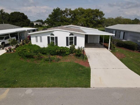 Photo of 8029 Meadowlark Lane, Port Saint Lucie, FL 34952 (MLS # B26062212)