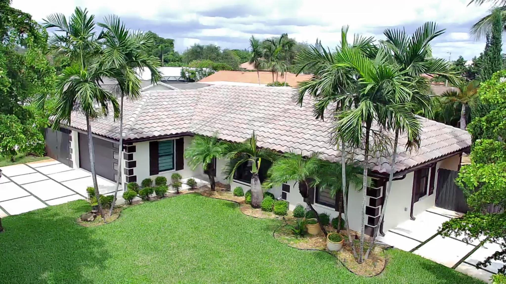 This pool home is a must see. CBS built with two car garage and tile roof. Open and bright along with a modern floor plan. Beautiful backyard, with a heated pool and hot tub, gazebo and outdoor kitchen. Kitchen has stainless steel appliances, tumbled marble back-splash that overlooks Florida room. Updated baths, built-in-book shelves, French door sliders, upgraded lighting and designer drapery add to the elegance and charm of this home. Pool has in-ground spa attached. Large Florida room/TV room has Spanish tile, lots of windows, tile floor with views of pool and patio area.