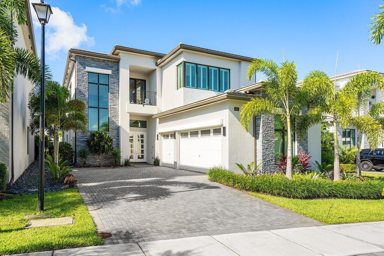 Highly coveted Boca Bridges contemporary Adriana model sited on a private oversized lake lot. Featuring 5 bedrooms plus office plus loft. As you enter the home you are greeted by soaring ceilings and a long view of the lake and pool. Oversized porcelain tile downstairs and wood upstairs. The elegant upgraded kitchen with custom one of a kind marble counter tops is a show stopper. Incredible upgrades including electric window treatments, plantation shutters, designer light fixtures, built ins, magnificent landscaping and so much more. Complete Impact Glass, Natural Gas and too many upgrades to list all inside the ultimate one and only Boca Bridges community offering the premier South Florida Lifestyle.